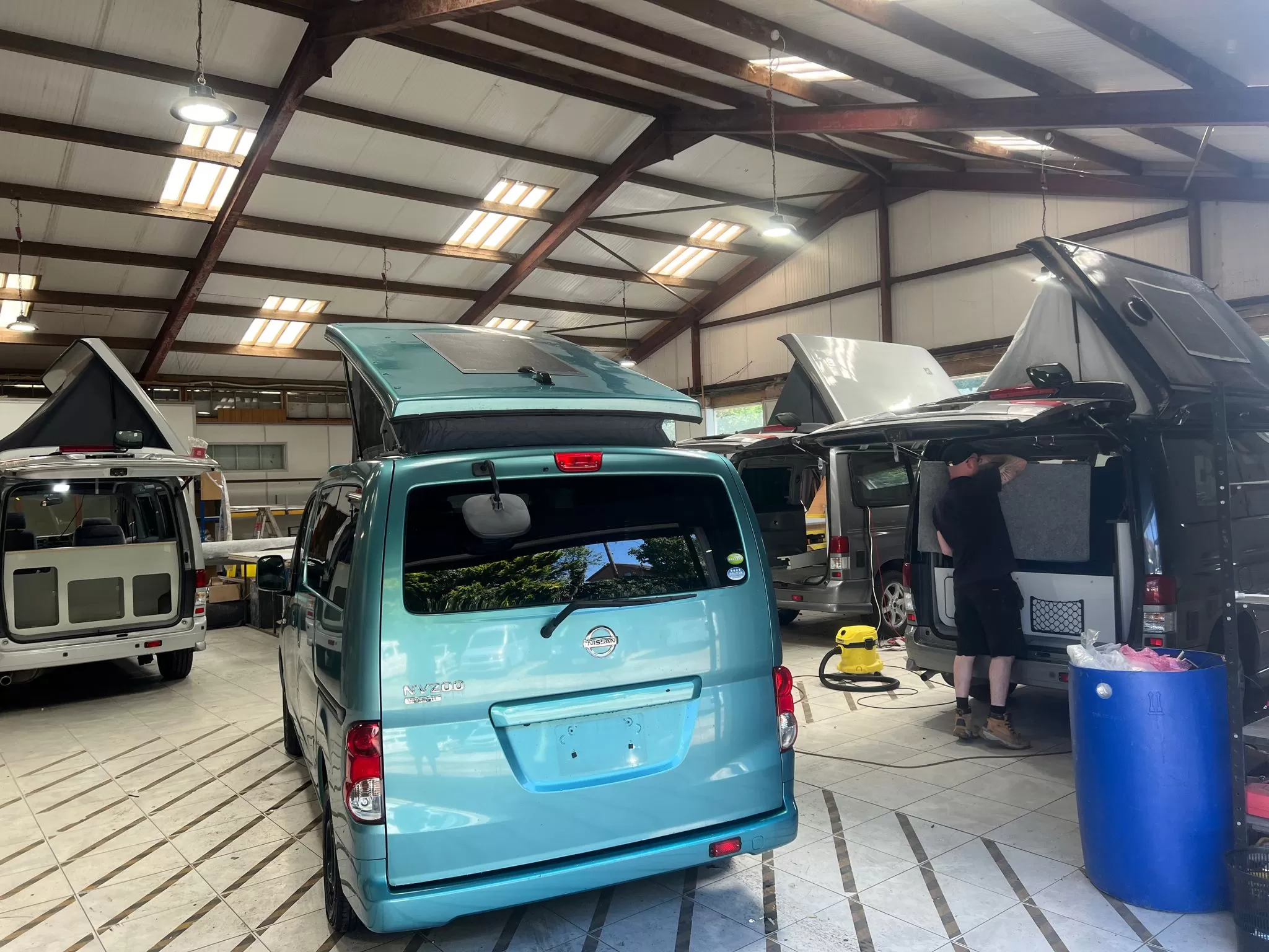 Blue Nissan camper conversion